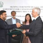 Exchange of agreements between Dr. Abdul Azeem, Director General of the Department of Archaeology and Museums (DOAM), Pakistan, and Dr. Mark Allon, University of Sydney.